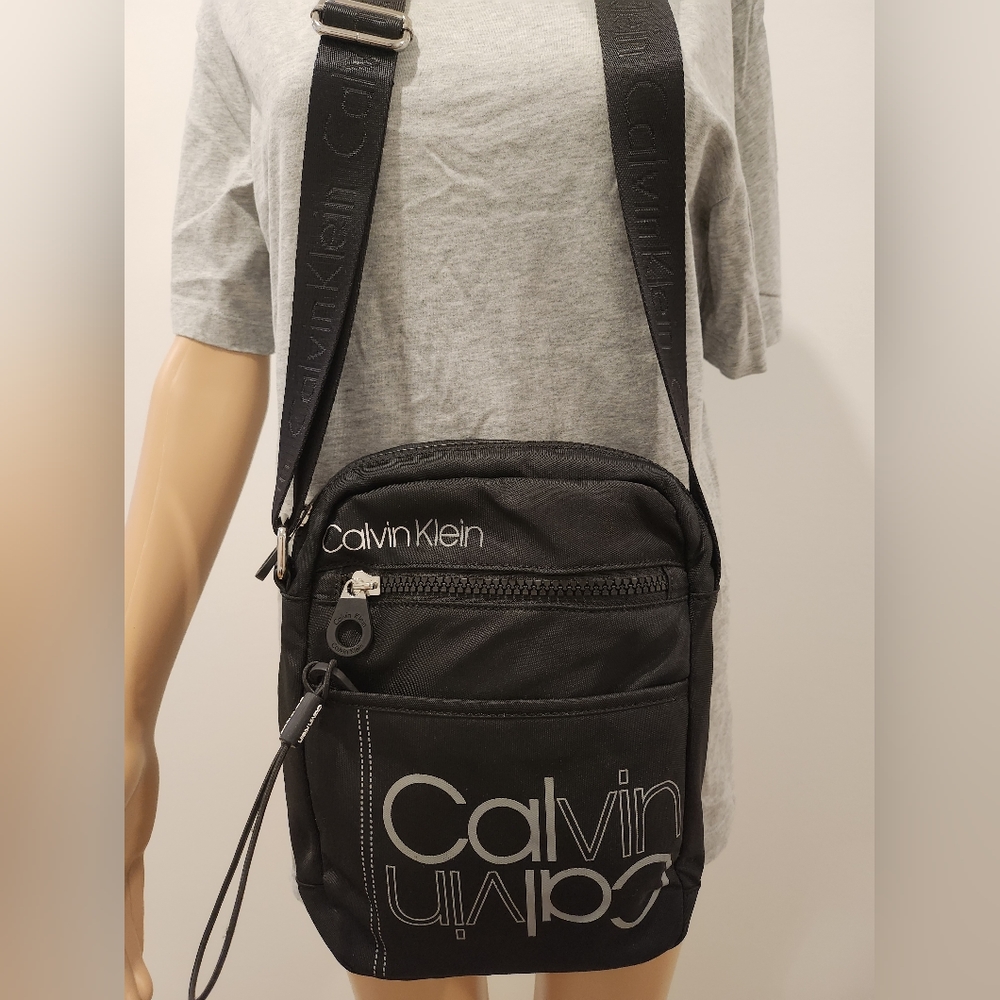 Black Calvin Klein Unisex side bag.